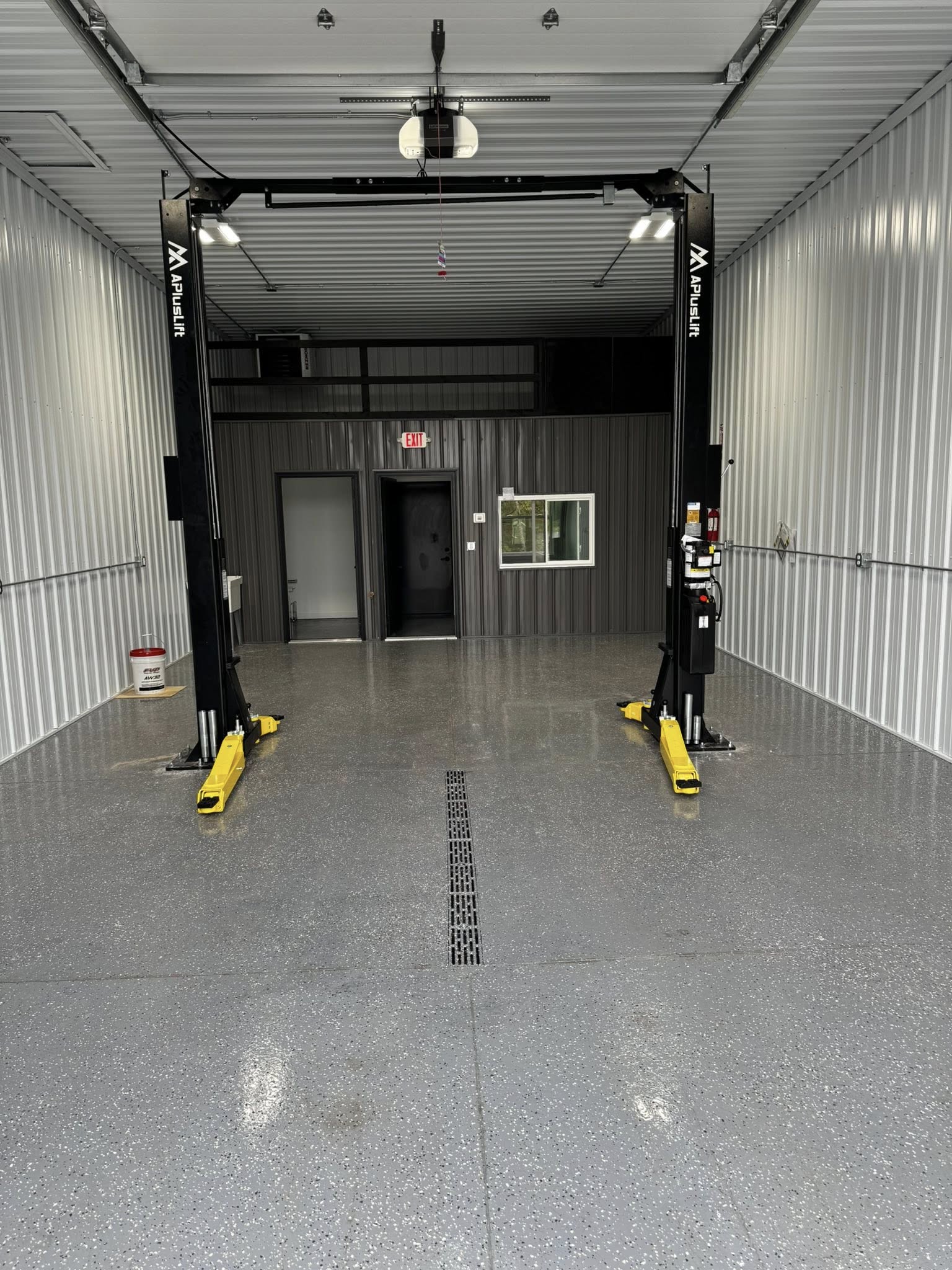 Shop bay with two-post lift